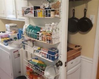 packed kitchen and pantry/laundry room