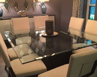 Alemeda dining table polished edge glass top with rounded corners. Base exterior surface covered in Capital shell.