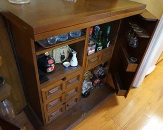 Vintage bar serving cart shown with tops folded in.