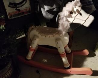 All wooden rocking horse.  Needs some TLC, but it is solid