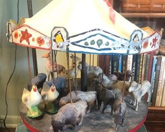 Folk art carousel with celluloid animals