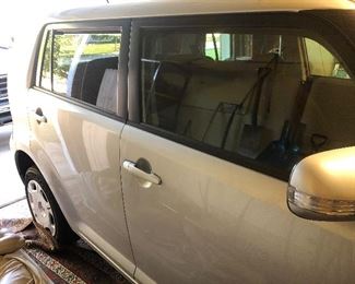 Scion XB with 5346 miles, modified for a handicapped person in a wheel chair. Car has damage to passenger front bumper and some dents.