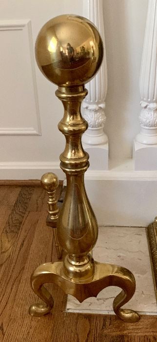 $150 Pair of brass fireplace andirons; each is 11" W x 27" H x 24.5" D. One of two. 