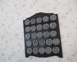 Pewter coins on display.
