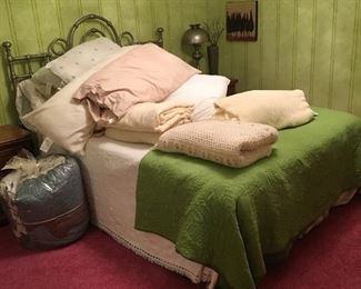 bed, bedding, side tables, lamps