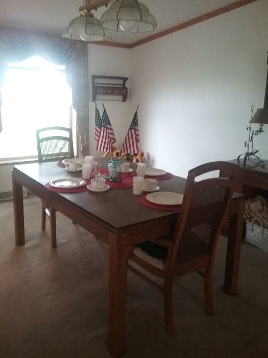 Dining room table with 2 chairs and two leaves.   Comes with place settings. $75.00
