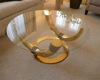 $595- Brass Tusk Coffee table with glass top. 36" diameter, 15" high. 