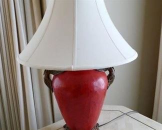 $65 - Table lamp.  Faux leather finish in a rich cinnabar red color.  Bird accents at the top. 27" high (after)
