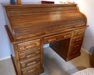 $50 - Oak roll top executive desk. Top is removable. 58" w x 27"d x 30"h x 45" to top of rolltop. (now)