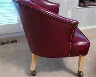 $200 - Set of four rolling club chairs.  Oxblood red faux leather upholstery with nailheads. Excellent condition. 