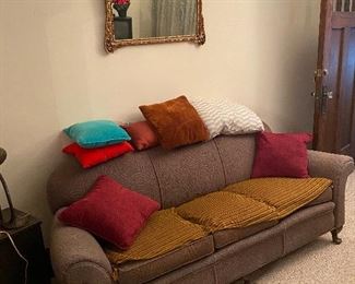 Vintage sofa, throw pillows, gilt gold framed mirror