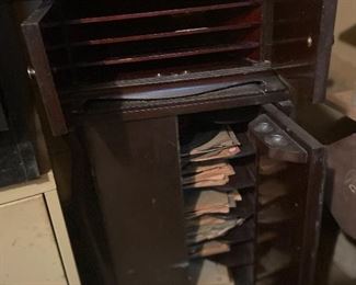Antique record stand filled with old records