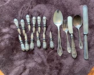 #84	 12 Corn On The Cob holder spikes and misc silverware	 
                          $15.00
