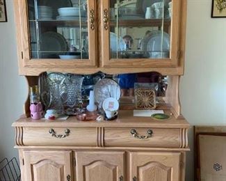 #64	Oak Hutch Mirror behind leaded glass doors with lights, 2 drawer 3 cupboards. Needs some repair on the bottom cupboard.	$125.00
