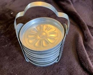 #23	Aluminum vintage coasters with stand set of 8	$16.00
