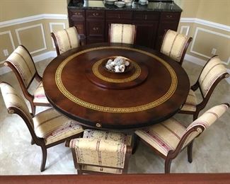 Exquisite, Mahogany Versace Dining Set with seating for 8 in hard-to-find 60" round. Gold Greek Key pattern, gold rosettes and gilding on the claw feet are breathtaking. The Lazy Susan adds a perfect touch of functional appeal to make this a truly magnificent ensemble.  
