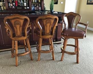 Set of 3 solid wood & leather bar stools. This trio is in perfect condition and ready to add a touch of class to your bar, den or kitchen area.  22" x 16" x 30" (at seat), 46" (at top of back)