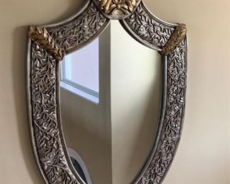 Magnificent Shield Mirror in silver and bronze tones.  Measures approximately 3' x 5'. 