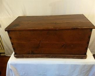 Antique medium wooden storage chest with chorded rope handles, dove-tail wooden inlay construction, antique hinges with hinged top and lock ion front. Internal storage compartment with wooden top.