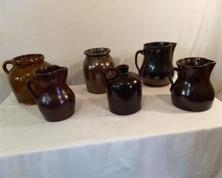 Various ceramic clay pots, pitchers, and vases