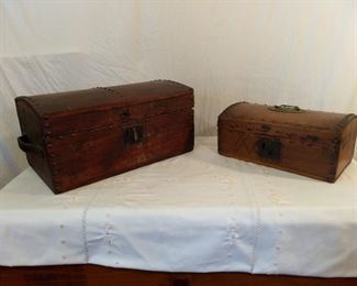 2 antique boxes; 1) Black wooden box with leather handles on each side with rivets on top 2) Black wooden box small lock on front with rivets