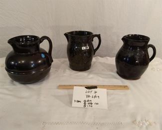 3 large ceramic pitchers