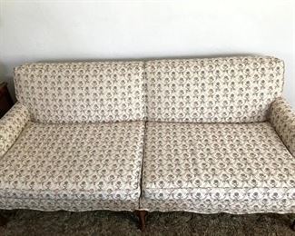 Like brand new. Sofa features wooden arms and legs. Delicate pattern. Starting price $30.00