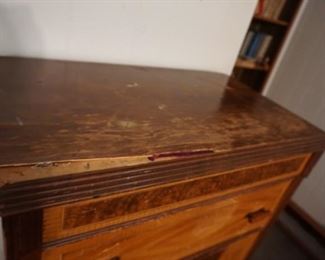 damage on top of chest of drawers