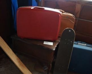 luggage, table, skate board