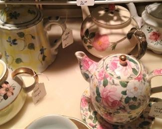 Desert Rose tea pot and other pink and yellow teapots
