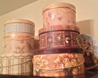 Some of the many decorative hat/organizing boxes