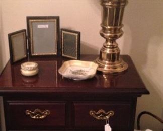 Nightstand; brass lamp