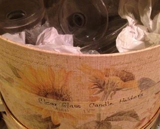 Decorative box filled with clear glass candle holders