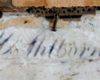Signature on the back of the porcelain plaque