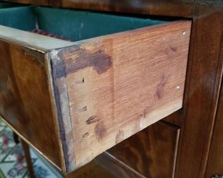 Pulled out drawer of sideboard showing age