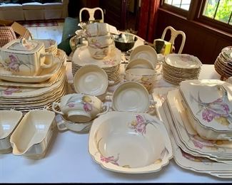 Item 90:  Tulip Pattern Dishes $150 - 11 dinner plates, 12 salad plates, 11 dessert dishes, 6 berry bowls, 12 saucers/3 cups, 11 double handle cups, creamer & sugar, 1 teapot, 1 gravy dish, 1 covered dish, 4 platters, 2 serving bowls: