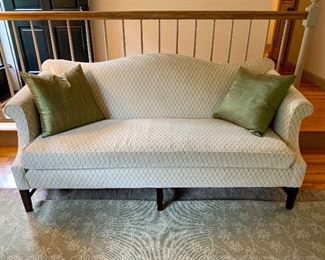 Item 57:  Upholstered camel back sofa, bench seat, nicely upholstered (73"l x 23"w x 34"h): $400