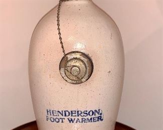 Item 156:  Antique Henderson Foot Warmer ($65) stamped on bottom of bottle "Dorchester Pottery Wks Boston, MA."  Metal knob reads "PAT NOV 5, 1912."  Measures approx, 11"h x 5.5" wide x 5" deep (including metal cap). Original knob and chain:  