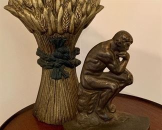 Item 178:  (2) vintage wheat and thinker doorstops: $28