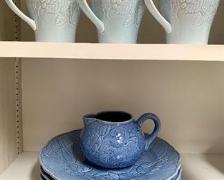 Pretty little lot of dishes, creamer and three mugs: $18