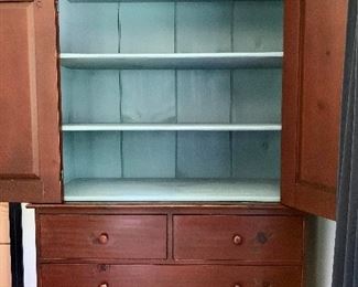 Painted sky-blue on inside of top cabinet.