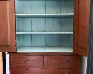 Painted sky-blue on inside of top cabinet.