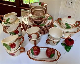 Item 89:  Franciscan "Apple" Earthenware - 8 dinner plates, 8 berry bowls, 7 luncheon plates, 8 cups/9 saucers, creamer & sugar, salt & pepper shakers, 1 candlestick holder and butter dish (no lid): $200