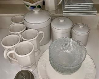 White cannisters, clear bowls, white plates, creamer, mortar and pestle, mugs and butter keeper with pewter top: $30