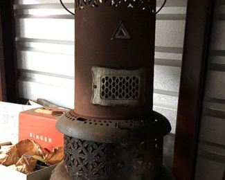 ONE OF SEVERAL ANTIQUE WOOD BURNING STOVE