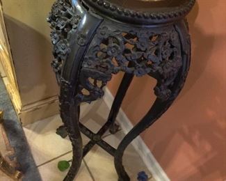 heavily carved plant stand marble insert