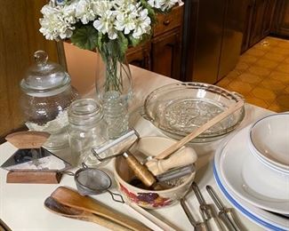 Vintage kitchen utensils, clear glass canister and storage jars