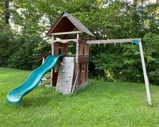 Cedar jungle gym with slide, climbing wall, swings (see other pic), and playhouse. If you buy this new, it is over $2,000. This is a great deal for a handy person  that can spruce this up.  