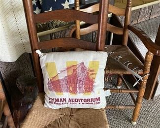 Ladder back chairs. Awesome pillow from Ryman Auditorium. 