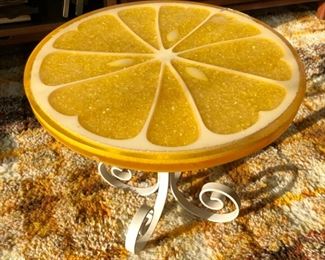 Fun table with lemon slice top and metal base.